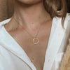 Betty and Biddy Dá fhada an lá tagann an tráthnóna Round Disc Necklace, Gold