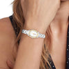 Tommy Hifiger Ladies Demi Oval Watch, Gold & Silver